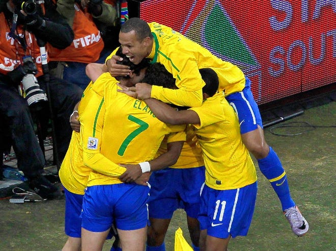 Brazilians celebrate after Blumer Elano (7) scored the team's third goal in a 3-1 victory over Ivory Coast in Group G play of the World Cup in Johannesburg, South Africa, on Sunday.