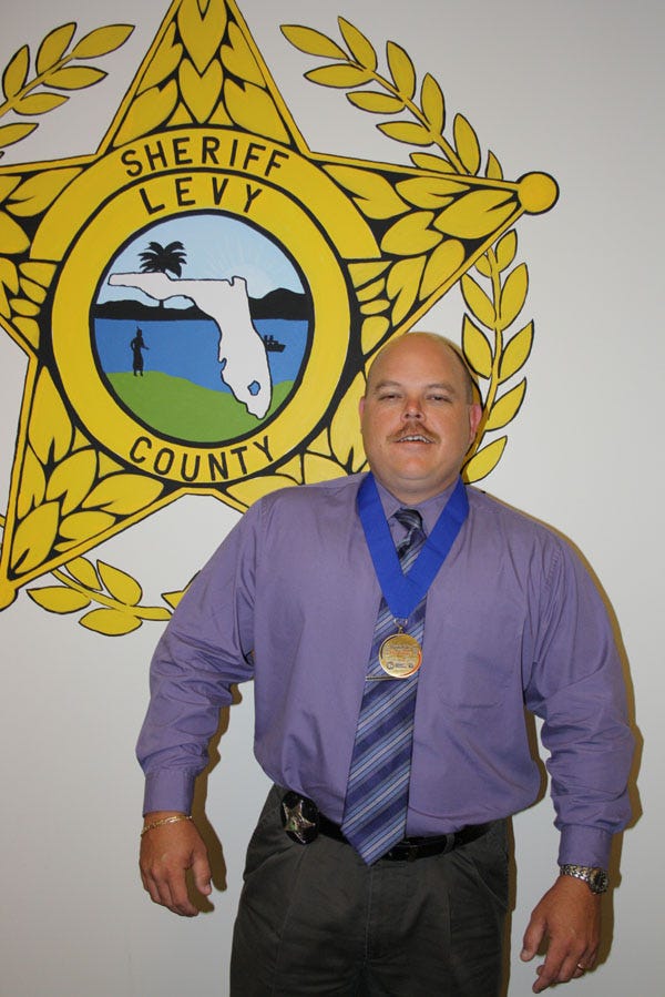 Levy County sheriff's investigator takes gold in Police & Fire Games