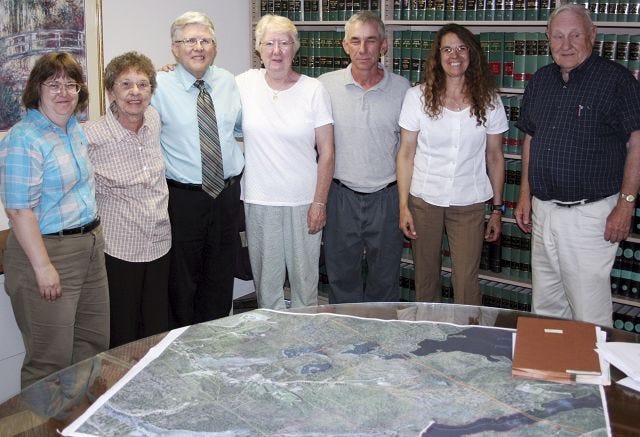 John Nolan/Times photo 
A 55-acre parcel of land off Rochester's Dry Hill Road which contains a heronry was officially put into conservation at a signing of papers on June 22. From left are DES Water Supply Land Protection Grant Coordinator Holly Green, co-owner Norma Berube, City Manager John Scruton, co-owner Janice Smith, Conservation Commission member Jeff Winders, Strafford County Conservation District Manager Bambi Miller and Attorney Russell Shillaber.