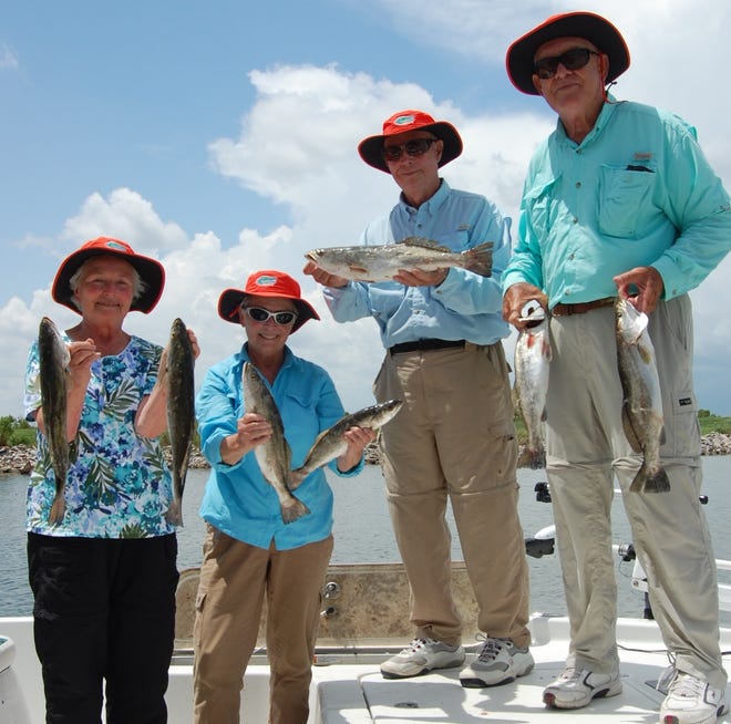 Two couples from Florida enjoy some of Louisiana’s bountiful fishing with Captain Ryan Young.