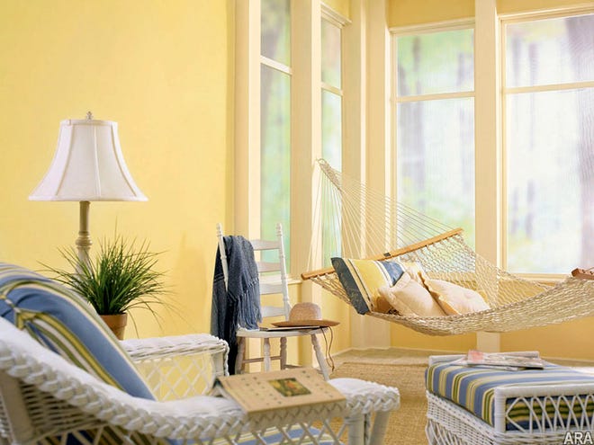 Sandy tans and bright whites evoke a beachy feel. Invest in a few wicker pieces of furniture to lighten up a room.