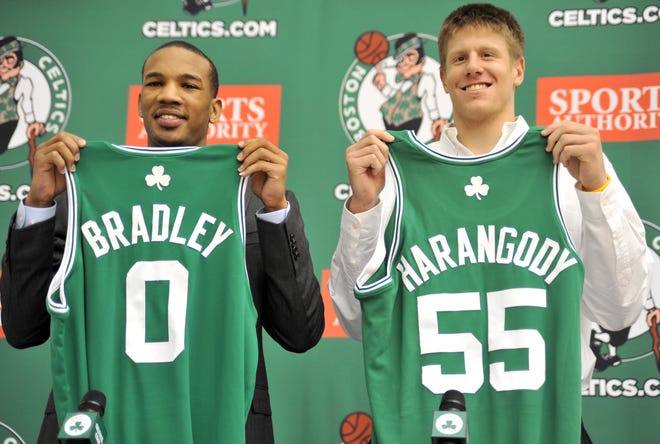 Celtics draft picksAvery Bradley andLuke Harangody hold up their team jerseys during a news conference on Friday in Waltham.