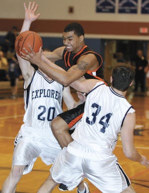 Michael Porrini, center, goes between a pair of Hudson defenders during his senior year at Massillon in 2007.