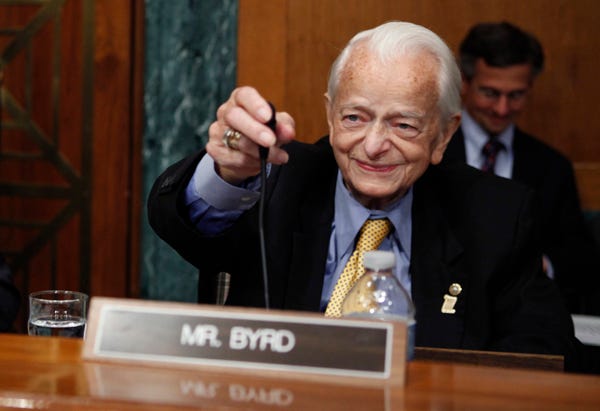 FILE - In this May 20, 2010 file photo, Sen. Robert Byrd, D-W.Va., readies his microphone as he arrives to question panel members on Capitol Hill in Washington, during the Senate Health and Human Services subcommittee hearing on mine safety.  Sen. Robert Byrd of West Virginia, a fiery orator versed in the classics and a hard-charging power broker who steered billions of federal dollars to the state of his Depression-era upbringing, died Monday, June 28, 2010.