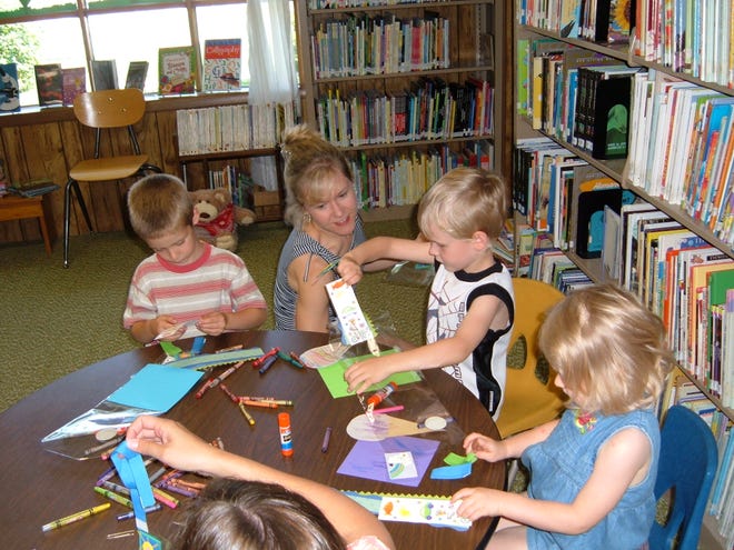 With a packet of materials provided by Danita Scheirer, the Story Hour Lady, the children at the Germantown Hills Branch of Illinois Prairie District Public Library used their imaginations to create a ‘one-of-a-kind’ collage. Summer Story Hours continue at Germantown Hills at 10 a.m. on Thursdays until July 15. Call 383-2263 for more information and to register your 3-to-6-year-old child.