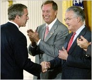 The former legislators Michael Oxley, center, and Paul Sarbanes with George W. Bush in 2002.