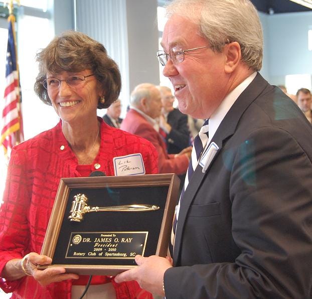Former U.S. Congresswoman Liz Patterson was named president of the Rotary Club of Spartanburg on Wednesday. Here, she is presented an honorary gavel from outgoing president Jim Ray.