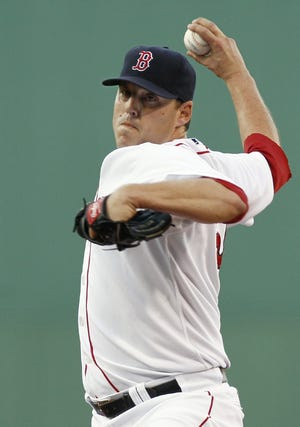Red Sox pitcher John Lackey delivers during the first inning of last night's win over the Rays.