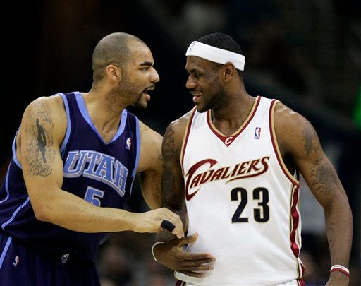Utah Jazz's Carlos Boozer (5), shown in this March 17, 2007 file photo, greets Cleveland Cavaliers' LeBron James (23) before an NBA basketball game, in Cleveland. James is the biggest prize among what's considered the deepest free agency class ever.