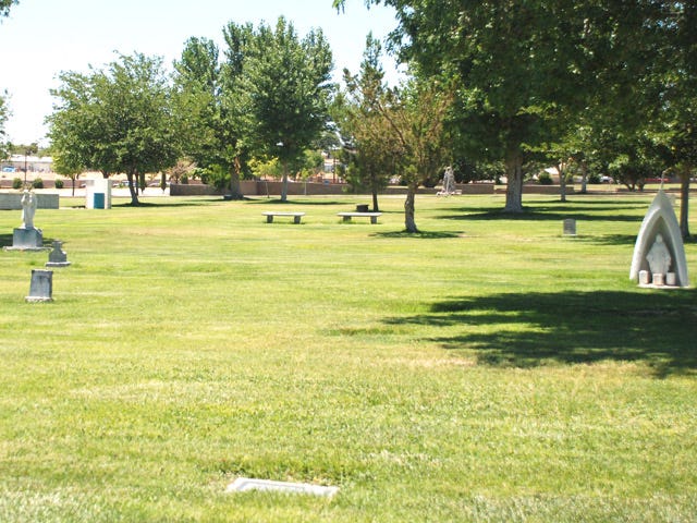 The headstones sit under the summer sun at Mt. View Memorial Park Thursday.