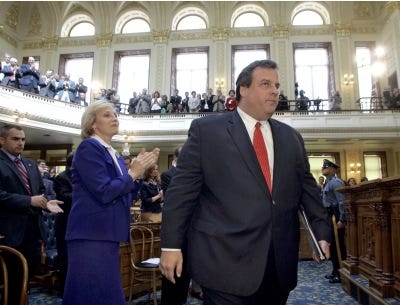 AP Photo/The Asbury Park Press, Thomas P. Costello Gov. Chris Christie arrives to address a joint session of the Legislature gathered at the Statehouse in Trenton Thursday to pitch his property tax cap proposal. Lt. Gov. Kim Guadagno is a