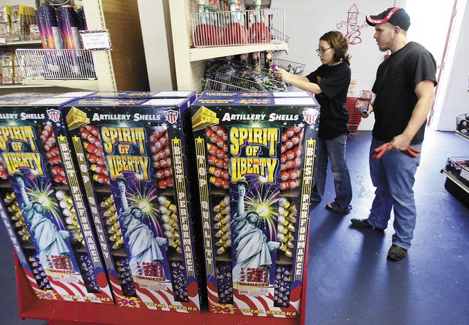Austin Smith and Amber Miller, both of Brewster, shop at Discount Fireworks in Massillon.