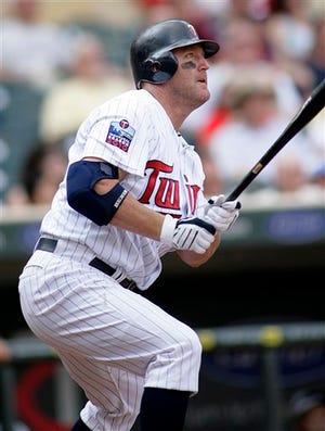 Minnesota Twins designated hitter Jim Thome watches his double in the ninth inning against the Tampa Bay Rays during their baseball game Saturday, July 3, 2010, in Minneapolis. The Rays defeated the Twins 8-6.