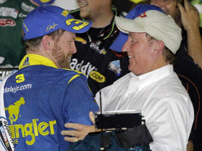 NASCAR driver Dale Earnhardt Jr., left, gets a hug from car owner Richard Childress after winning the Subway Jalapeno 250 auto race at Daytona International Speedway in Daytona Beach, Fla., Friday, July 2, 2010.