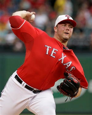 Texas Rangers starting pitcher Tommy Hunter delivers to the Chicago White Sox in the first inning of a baseball game Saturday, July 3, 2010, in Arlington, Texas.
