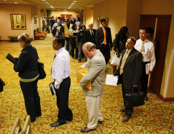 Job seekers wait in line to register and attend a National Career Fair in San Francisco.