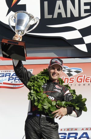 Will Power celebrates winning the IndyCar Series' Watkins Glen Camping World 
Grand Prix at The Glen in Watkins Glen, N.Y., Sunday.