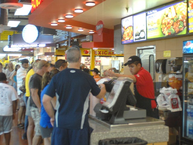 Dozens line up at Panda Express inside Barstow Station to get a bite to eat on Monday. The Fourth of July weekend was the busiest in at least a year, said Barsow Station owner Billy Rosenberg