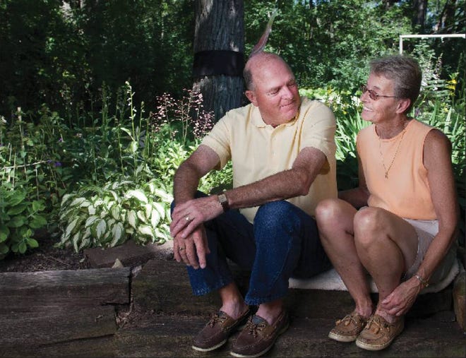 RETIREMENT: Dennis and Karen Defnet sit in their yard at their home on June 29 in Winneconne, Wis. The Defnets, who are in their 60s, have three annuities that pay them several thousand dollars a month combined.