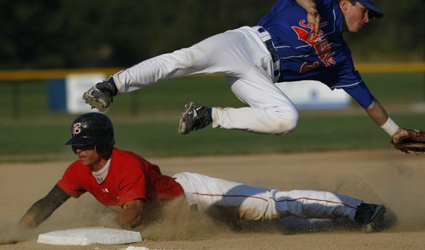 Bourne reliever R.J. Alvarez covers first base for the out against Zach Osborne of Hyannis late in Wednesday's game.