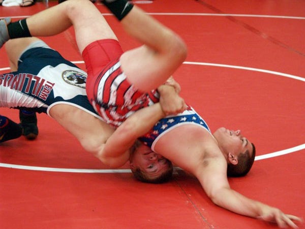 West Cathcart (bottom) takes down his opponent at the Junior Greco-Roman Nationals.