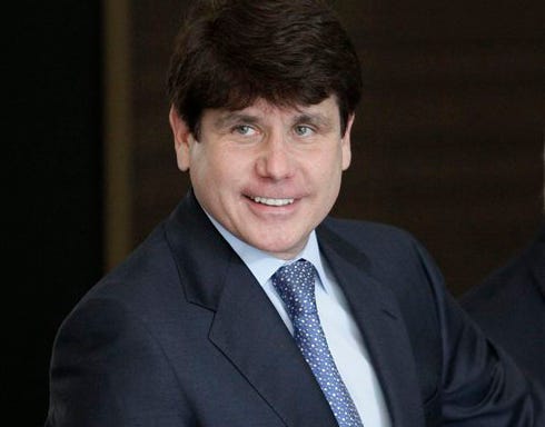 Former Illinois Gov. Rod Blagojevich smiles as he arrives at the federal building in Chicago, Wednesday, July 7, 2010, for his corruption trial.