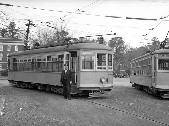 Two Tuscaloosa streetcars meet at Lawn Station on University Boulevard in 1941. The electrified line, which had operated since 1915, yielded later that year to buses.
