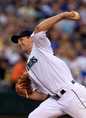Seattle Mariners starting pitcher Cliff Lee throws against the Chicago Cubs Wednesday during the sixth inning. The Associated Press