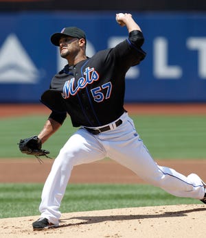 Mets pitcher Johan Santana delivers in the first inning. He allowed five hits and three walks in seven comfortable innings, striking out five.