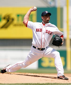 Josh Beckett delivers a pitch during his rehab start with the Pawtucket Red Sox on Sunday.