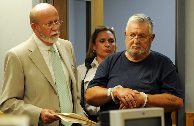 FALMOUTH -- 071210 -- Edmond Carriere, right, accompanied by his attorney Jack Atwood, was arraigned in Falmouth District Court on charges that he arranged for the murder of his wife, Frances, 30 years ago. 071210ml01