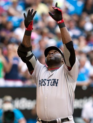 David Ortiz celebrates a go-ahead solo home run during the sixth inning of the Red Sox' 3-2 victory on Sunday in Toronto.