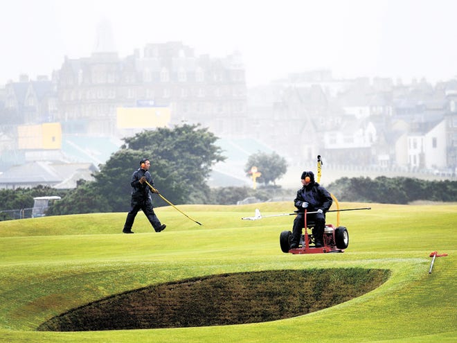 Greens keepers cutting the grass on the 17th green at the Old Course, St Andrews, Scotland, Saturday, July, 10, 2010. The 150th British Open starts at St. Andrews, Scotland on Thursday July 15, 2010. Everything looks about the same at St. Andrews since the last time the British Open was played there. There is, however, one big exception: The Road Hole has been expanded some 40 yards and is more imposing than ever.