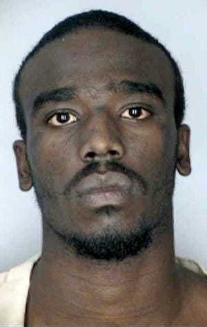 In this 2003 Hillsborough County Jail booking photo, Dontae Rashawn Morris, is said to be a person of interest in the shooting death of two Tampa, Fla., police officers Tuesday, June 29, 2010 in Tampa.