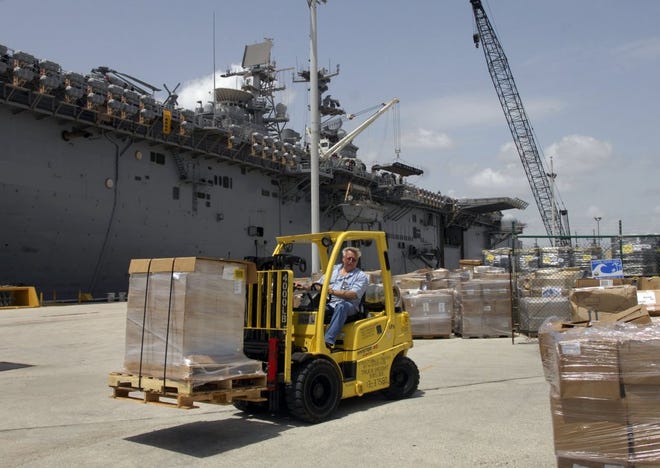 The USS Iwo Jima docks Saturday at Mayport Naval Station to pick up supplies for Operation Continuing Promise. The annual project offers humanitarian aid, including medical services, to countries in the Caribbean and South America.