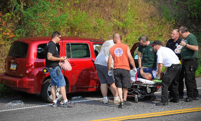 One woman is extracted from a vehicle after a collision at the intersection of Route 191 and Stroudsmoor Road in Stroud Township on Friday afternoon.