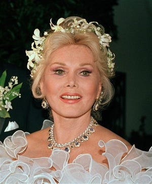 Actress Zsa Zsa Gabor is shown Los Angeles, in an Aug. 15, 1986 file photo. Zsa Zsa Gabor is scheduled to have surgery Tuesday, Sept. 17, 2007 for "severe infection in her legs," her publicist said. Gabor's publicist says the 93-year-old actress has been rushed to a hospital Saturday July 17, 2010 after falling out of bed and breaking several bones. The actress is partially paralyzed from a 2002 car accident, which forced her to use a wheelchair. She also reportedly had a stroke in 2005.