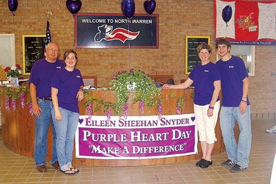 Submitted Photo- Eileen Snyder’s family, pictured here, was given a copy of this year’s yearbook, dedicated to Snyder during Purple Heart Day.