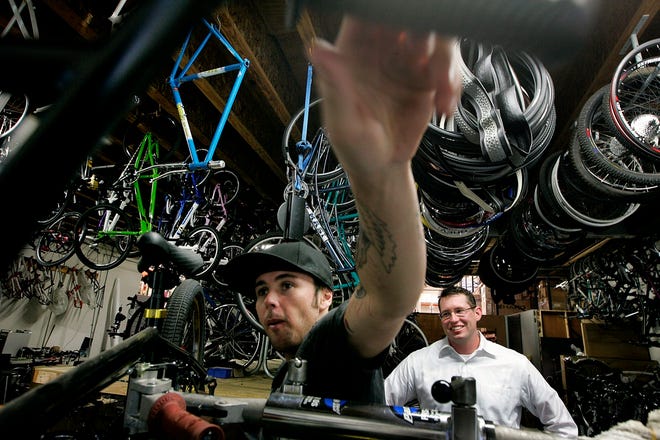 Derek Betcher, left, and Peter Skoda work at Haro Bicycle Corp., a Vista, 
Calif., business that employs 30 people. To lower rates, Haro switched to a 
health plan that accepts fewer doctors.NEW YORK TIMES / SANDY HUFFAKER