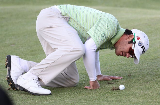 South Africa's Louis Oosthuizen looks at his ball on the 17th fairway during the third round of the British Open Golf Championship on the Old Course at St. Andrews, Scotland, Saturday, July 17, 2010. (AP Photo/Peter Morrison)