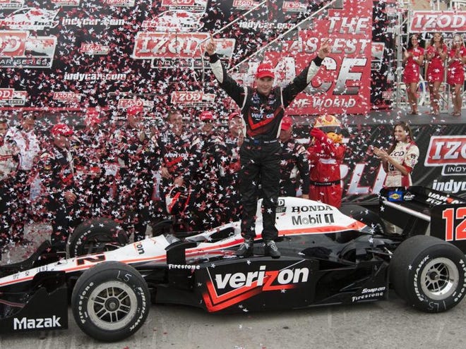 Will Power, of Australia, celebrates after winning the IndyCar Series' Honda Indy Toronto auto race in Toronto, Sunday.