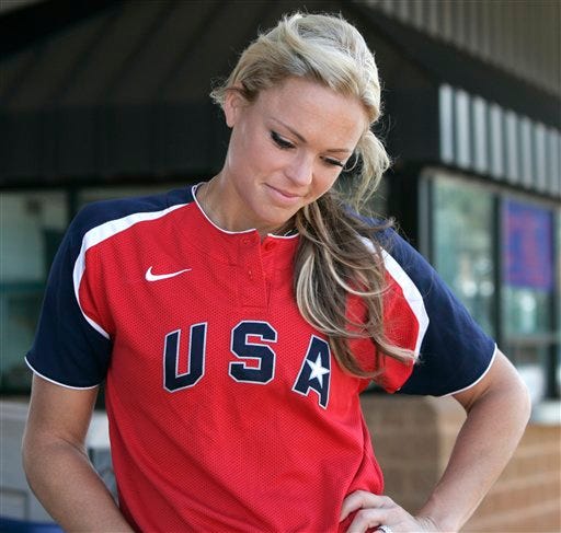 Olympic gold medalist Jennie Finch looks down as she contemplates a question about her decision to retire during an interview in Oklahoma City, Tuesday, July 20, 2010.