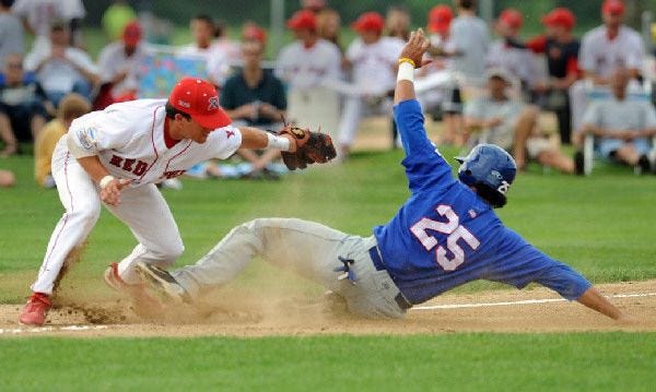 Rick Oropesa of Chatham slides safely into third ahead of the tag by Danny Muno of Y-D.