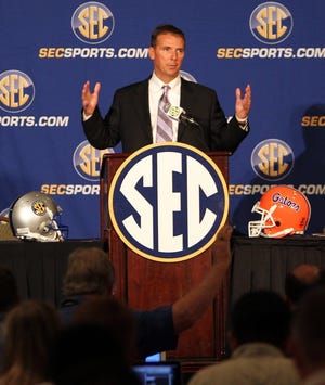 Florida coach Urban Meyer talks during SEC Media Days on Wednesday in Hoover, Ala.