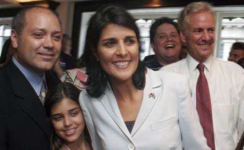 Republican candidate for Governor, Nikki Haley, center, celebrates her runoff victory with her husband Michael Haley, left, daughter Rena Haley, second from left, and former opponent Henry McMaster, right, at the Sheraton Hotel, in Columbia, S.C.,Tuesday