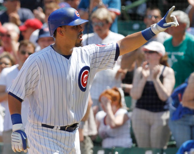 Chicago Cubs' Geovany Soto celebrates after hitting a solo home run against the St. Louis Cardinals during the fourth inning of a baseball game, Friday, July 23, 2010, in Chicago.(AP Photo/Nam Y. Huh)