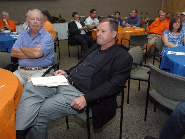 University of Florida co-defensive coordinator Chuck Heater, center, prepares to speak at Thursday's Gator Gathering at the College of Central Florida.