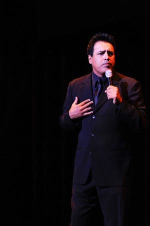 Comedian Willie Barcena entertains an audience.
