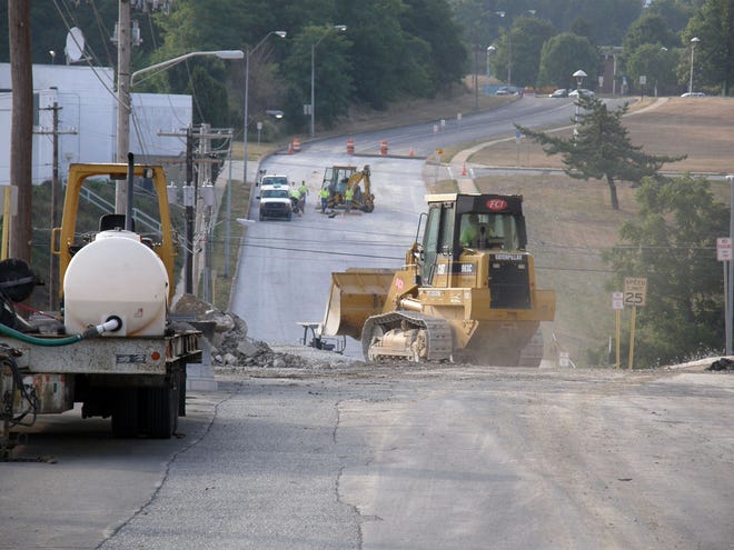 Fayetteville Contractors crews continue to rebuild a portion of East Second Street near Enterprise Avenue this morning.