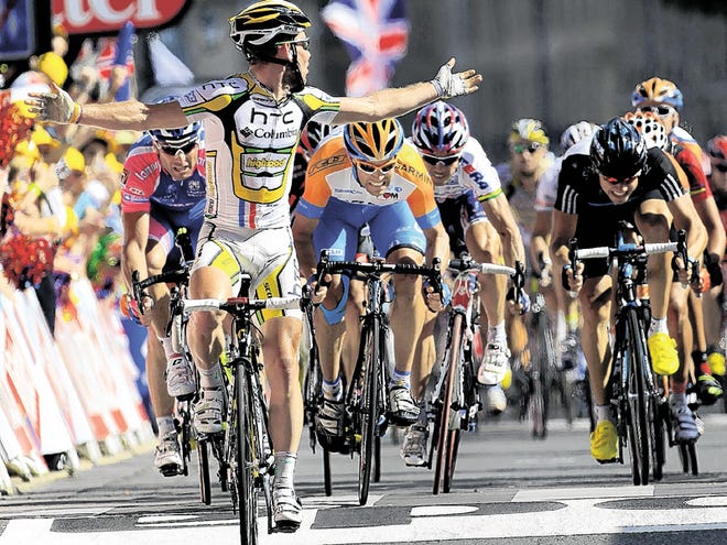 Stage winner Mark Cavendish of Britain looks back as he crosses the finish line to win the 18th stage of the Tour de France cycling race over 198 kilometers (123 miles) with start in Salies-de-Bearn and finish in Bordeaux, south western France, Friday, July 23, 2010. From left in the background are Alessandro Petacchi of Italy, Julian Dean of New Zealand, Robbie Mc Ewen of Australia, and Edvald Boasson Hagen of Norway.